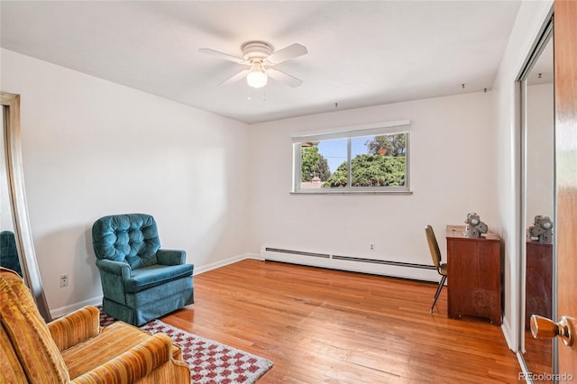 6920 W 47th Pl, Wheat Ridge, CO 80033 - sitting room with a baseboard radiator, a ceiling fan, and light wood finished floors