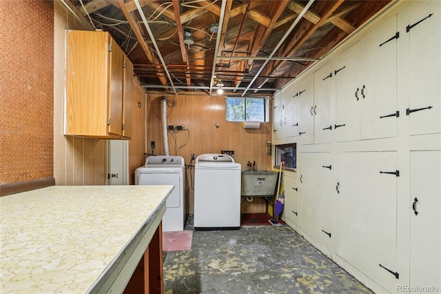 6920 W 47th Pl, Wheat Ridge, CO 80033 - washroom featuring washer and clothes dryer and wood walls