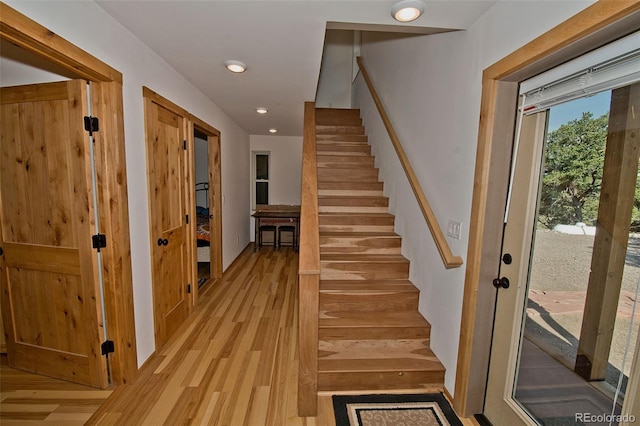 stairway featuring hardwood / wood-style flooring