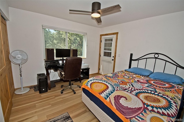 bedroom with light wood-type flooring and ceiling fan