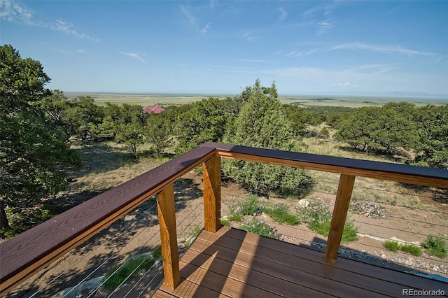 wooden deck with a water view