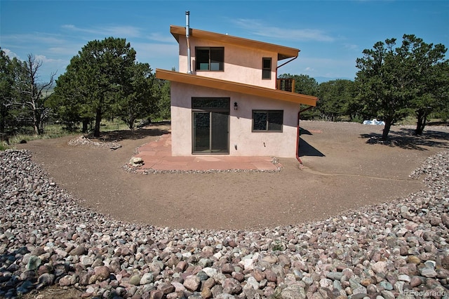 back of house featuring a patio