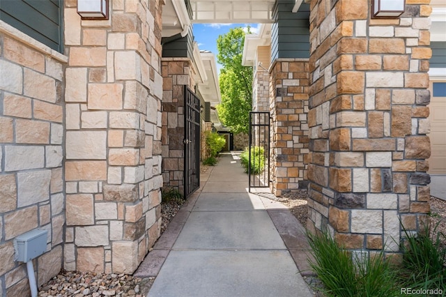 3329 Molly Ln, Broomfield, CO 80023 - property entrance featuring a gate and stone siding