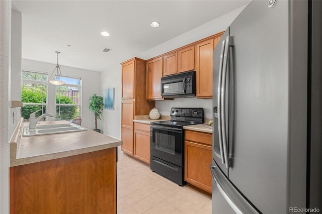 3329 Molly Ln, Broomfield, CO 80023 - kitchen featuring black appliances, a sink, recessed lighting, light countertops, and brown cabinetry