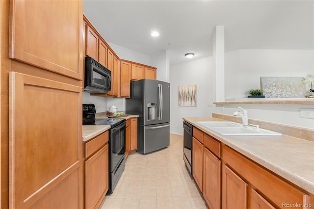 3329 Molly Ln, Broomfield, CO 80023 - kitchen with black appliances, a sink, light countertops, light tile patterned floors, and brown cabinetry