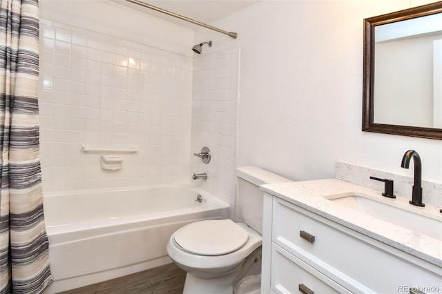 full bath featuring shower / bath combo, vanity, toilet, and wood finished floors