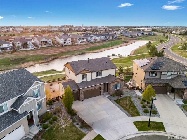 bird's eye view with a water view and a residential view