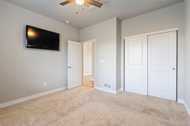 unfurnished bedroom featuring a closet, baseboards, carpet flooring, and visible vents