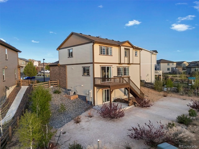 7207 S Scottsburg Way, Aurora, CO 80016 - rear view of house with stairway, a wooden deck, a residential view, and fence