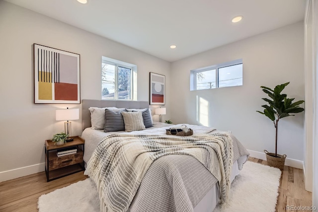 bedroom with light wood-type flooring