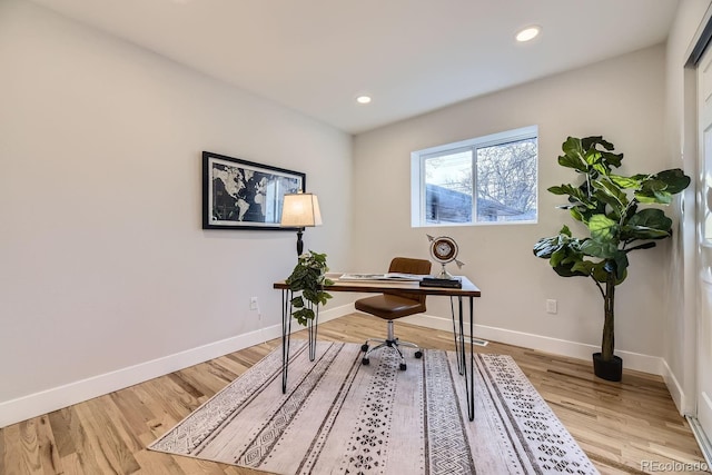 office with light hardwood / wood-style floors