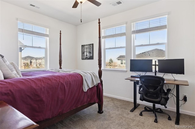 carpeted bedroom with multiple windows, visible vents, and baseboards