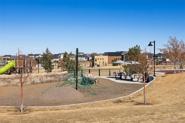 communal playground featuring a residential view