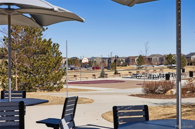 view of home's community featuring a residential view and community basketball court