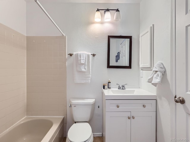 full bathroom featuring vanity, toilet, and tiled shower / bath