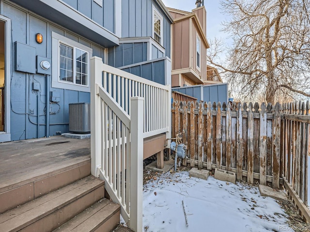 snow covered deck with central AC