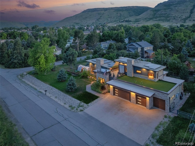 aerial view at dusk with a mountain view