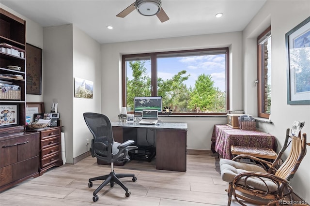 office area with ceiling fan and light wood-type flooring