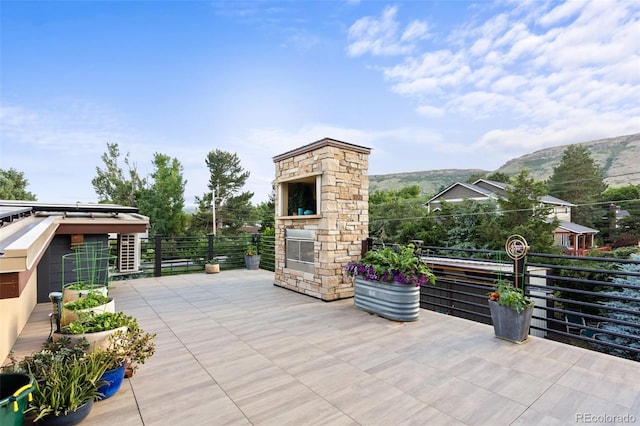 view of patio / terrace with a mountain view