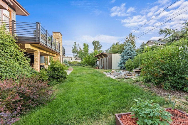 view of yard featuring a balcony