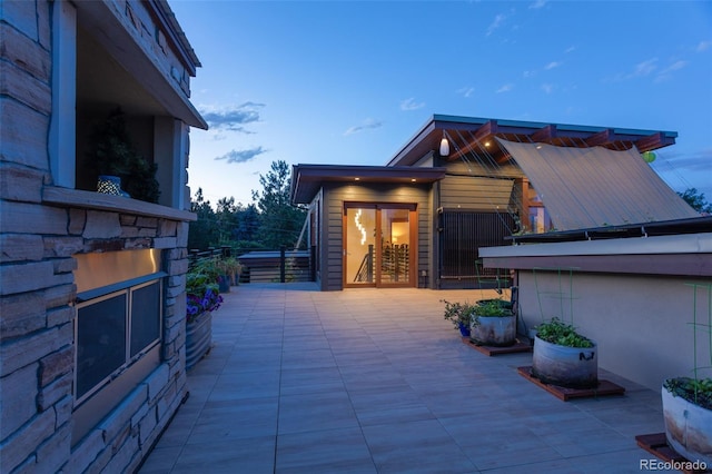 view of patio terrace at dusk