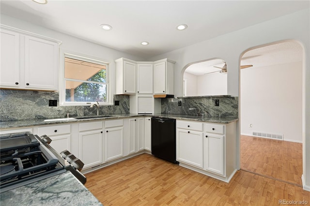 kitchen featuring black appliances, white cabinetry, and light hardwood / wood-style floors