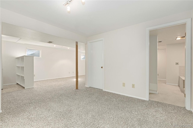 basement with light colored carpet