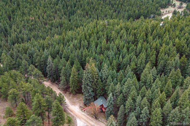 aerial view featuring a wooded view