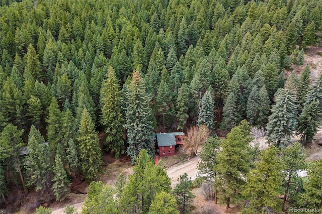 drone / aerial view with a view of trees