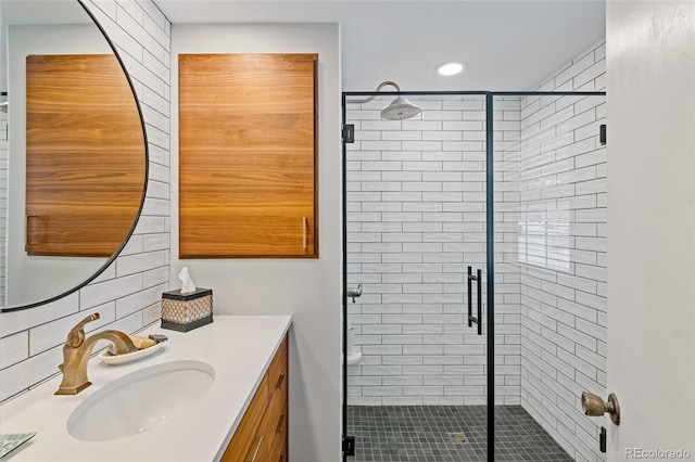 bathroom with vanity and an enclosed shower