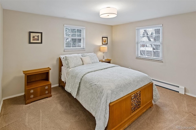 carpeted bedroom featuring a baseboard heating unit