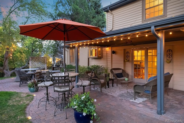 view of patio terrace at dusk