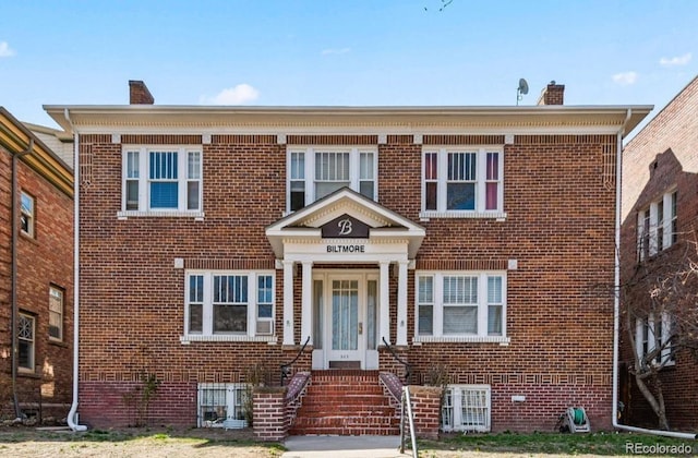 945 N Washington St Unit 201, Denver, CO 80203 - view of front of house with brick siding and a chimney