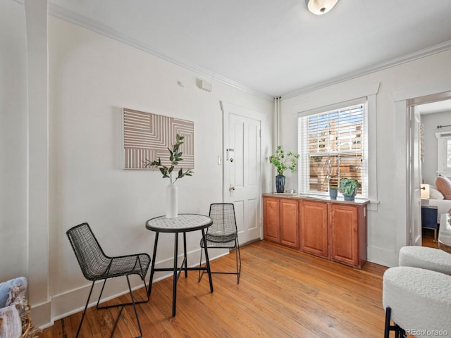945 N Washington St Unit 201, Denver, CO 80203 - living area with crown molding, light wood-type flooring, and baseboards