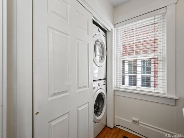 945 N Washington St Unit 201, Denver, CO 80203 - clothes washing area with wood finished floors and stacked washer / drying machine