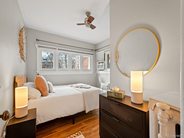 945 N Washington St Unit 201, Denver, CO 80203 - bedroom featuring cooling unit, wood finished floors, and ceiling fan