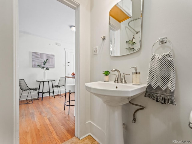 945 N Washington St Unit 201, Denver, CO 80203 - bathroom with baseboards and wood finished floors