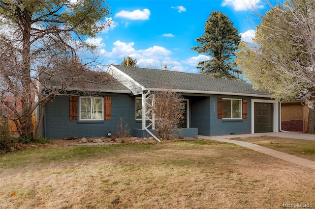 ranch-style house featuring a garage and a front lawn