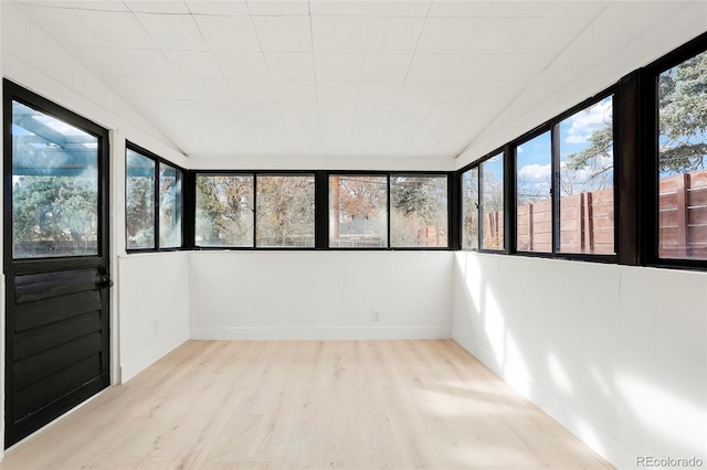 unfurnished sunroom featuring a wealth of natural light