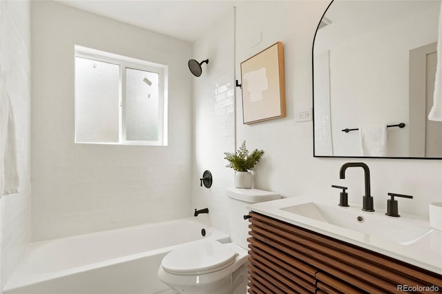 full bathroom featuring vanity, toilet, and tiled shower / bath