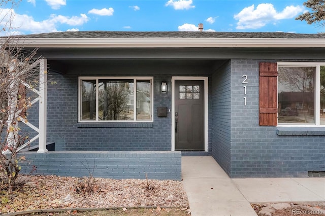 entrance to property featuring covered porch