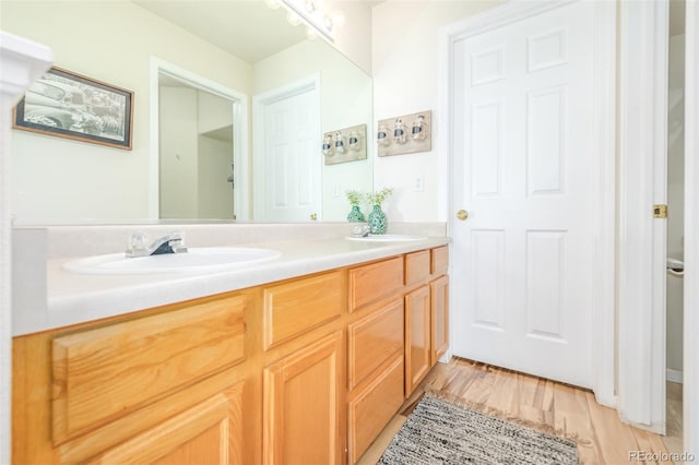 bathroom featuring vanity and hardwood / wood-style floors