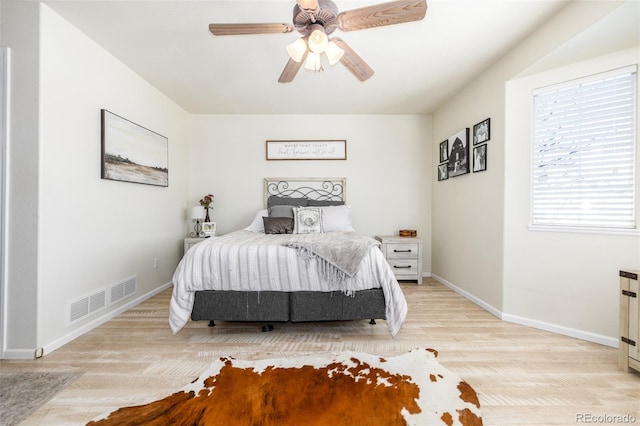 bedroom featuring light hardwood / wood-style flooring and ceiling fan