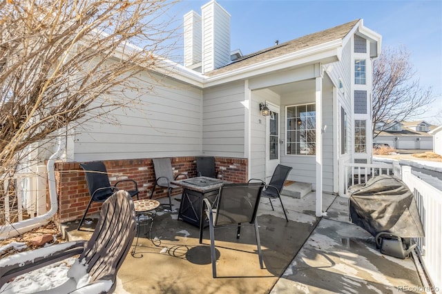 view of patio / terrace with a fire pit