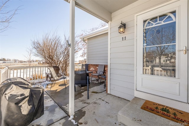 view of patio featuring a porch