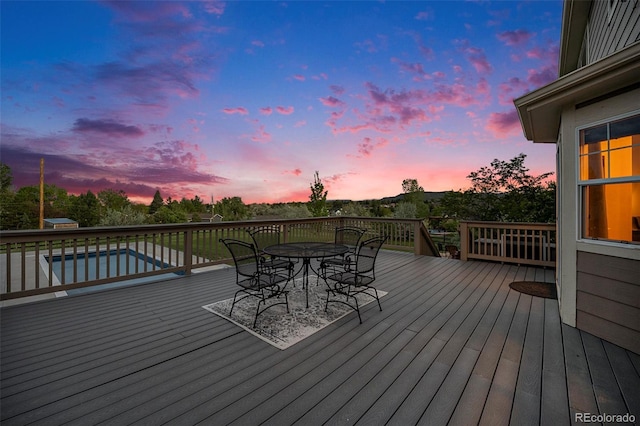 7624 Russell Ct, Arvada, CO 80007 - wooden deck featuring outdoor dining space