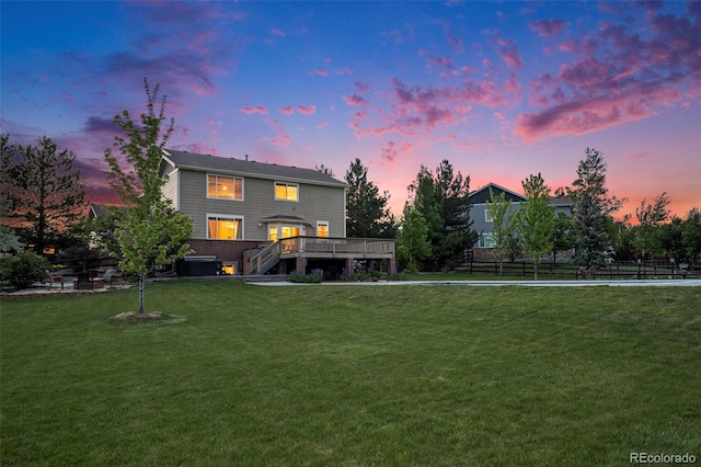 7624 Russell Ct, Arvada, CO 80007 - back of house at dusk featuring a deck