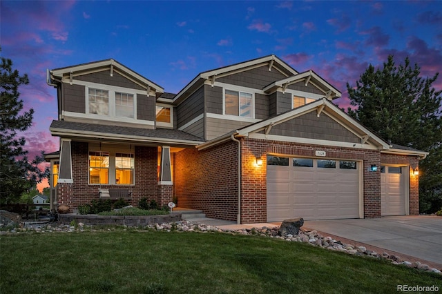 7624 Russell Ct, Arvada, CO 80007 - view of front of house with concrete driveway, brick siding, a front lawn, and an attached garage