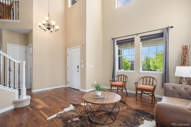 7624 Russell Ct, Arvada, CO 80007 - foyer featuring a high ceiling, stairway, wood finished floors, a chandelier, and plenty of natural light