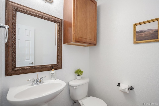 7624 Russell Ct, Arvada, CO 80007 - half bathroom featuring a sink and toilet